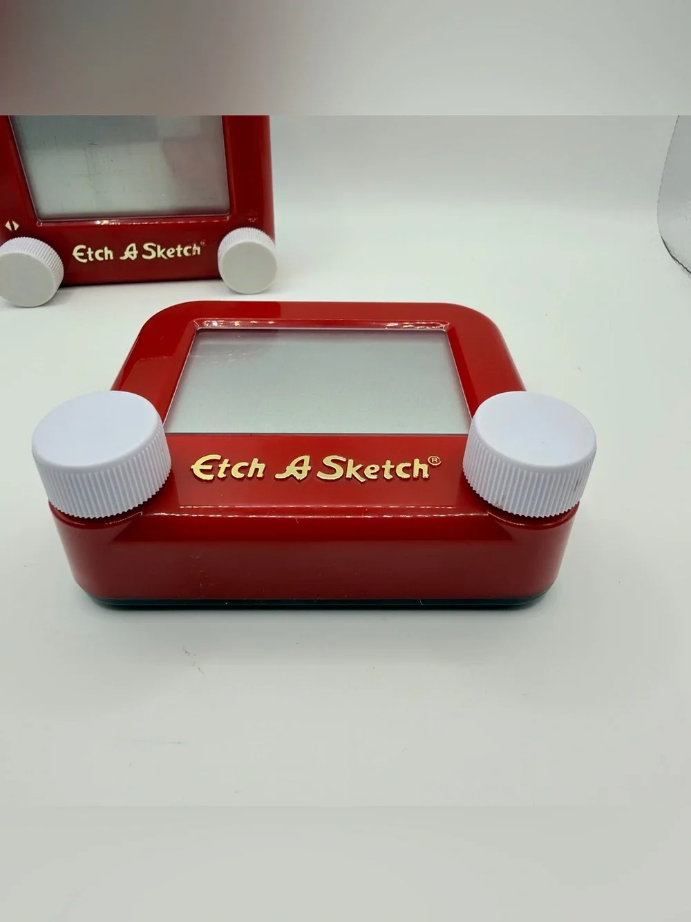 Pair of Mini Classic Red etch a Sketch toys